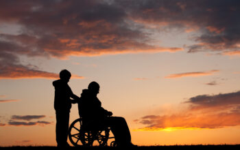Silhouette of Disabled Senior Man in a Wheelchair
